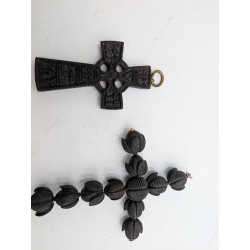 38 - Two 19th C. Irish bog oak crosses, three bracelets and three brooches.