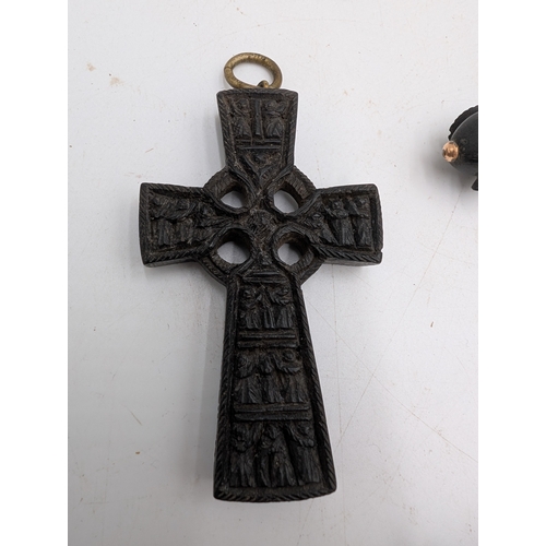 38 - Two 19th C. Irish bog oak crosses, three bracelets and three brooches.