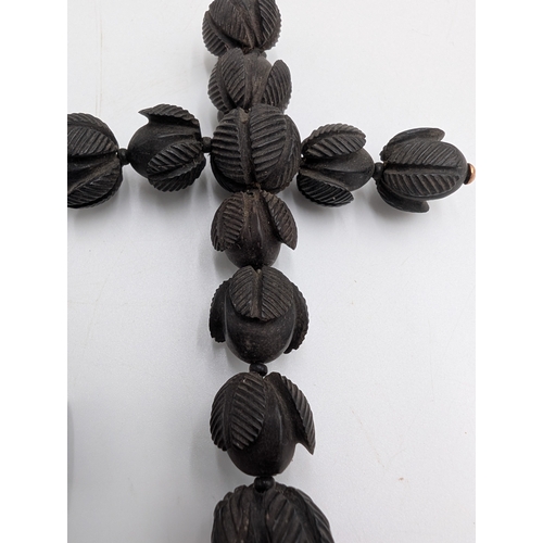 38 - Two 19th C. Irish bog oak crosses, three bracelets and three brooches.