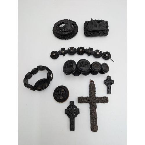 39 - Three 19th C. Irish bog oak crosses, three bracelets and three brooches.