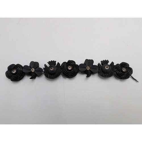 39 - Three 19th C. Irish bog oak crosses, three bracelets and three brooches.