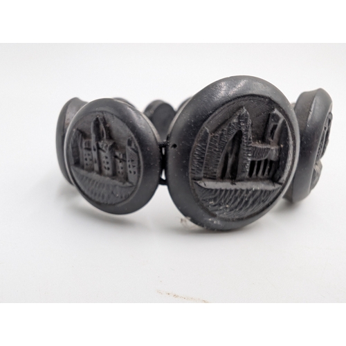 39 - Three 19th C. Irish bog oak crosses, three bracelets and three brooches.