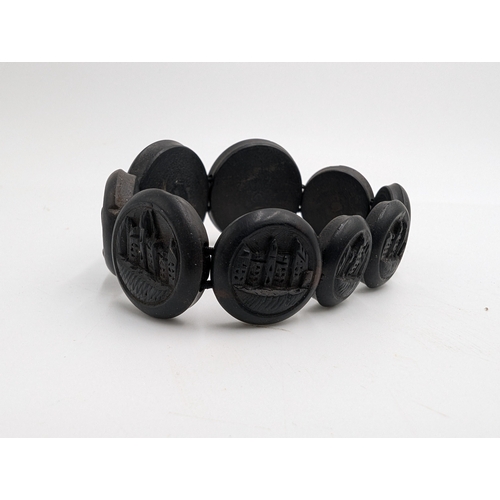 39 - Three 19th C. Irish bog oak crosses, three bracelets and three brooches.