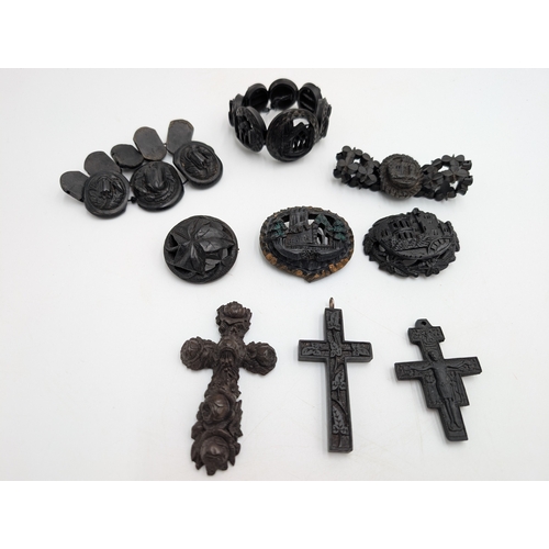 40 - Three 19th C. Irish bog oak crosses, three bracelets and three brooches.