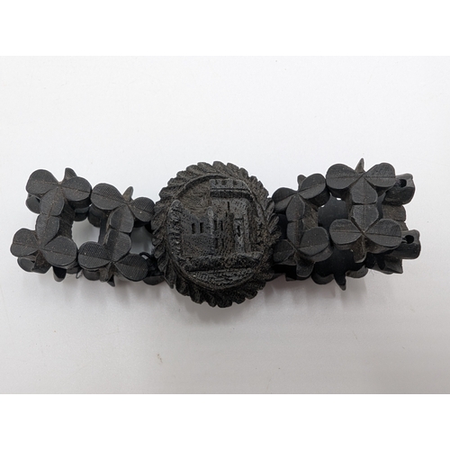 40 - Three 19th C. Irish bog oak crosses, three bracelets and three brooches.