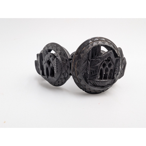 40 - Three 19th C. Irish bog oak crosses, three bracelets and three brooches.