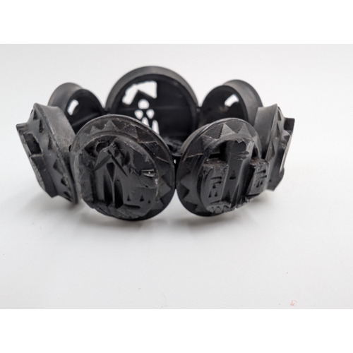 40 - Three 19th C. Irish bog oak crosses, three bracelets and three brooches.