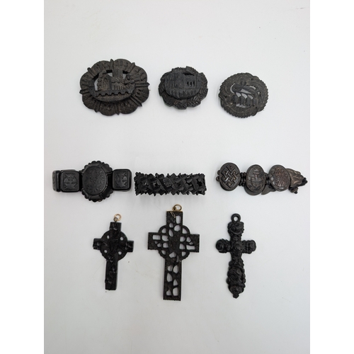 41 - Three 19th C. Irish bog oak crosses, three bracelets and three brooches.