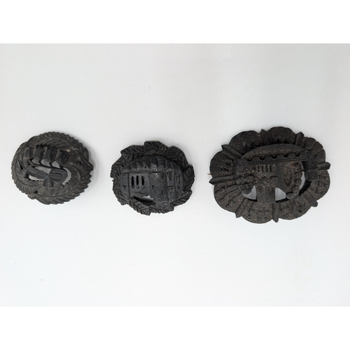 41 - Three 19th C. Irish bog oak crosses, three bracelets and three brooches.