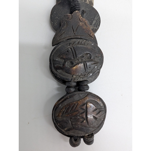 41 - Three 19th C. Irish bog oak crosses, three bracelets and three brooches.