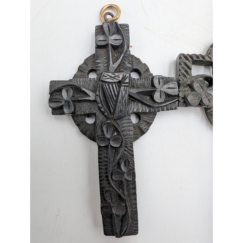 41 - Three 19th C. Irish bog oak crosses, three bracelets and three brooches.