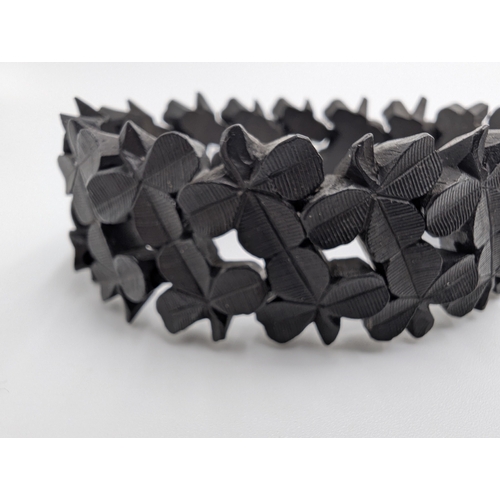 41 - Three 19th C. Irish bog oak crosses, three bracelets and three brooches.