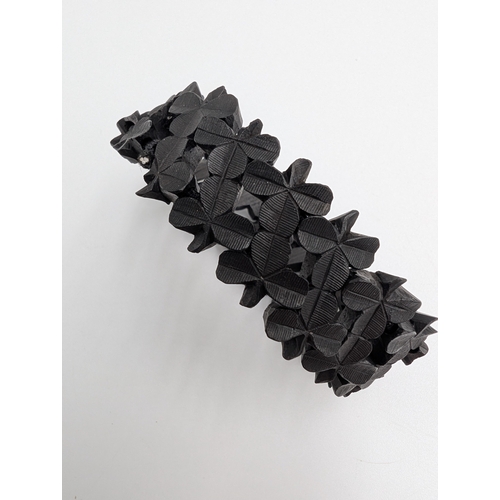 41 - Three 19th C. Irish bog oak crosses, three bracelets and three brooches.