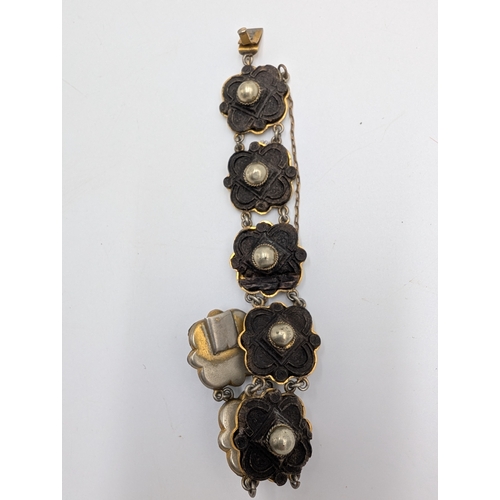 42 - Three 19th C. Irish bog oak bracelets, three brooches and single cross pendant.