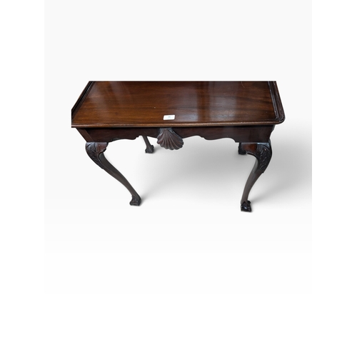46 - 19th C. Irish mahogany Silver table on four claw and ball feet with shaped shell apron. {74  cm H x ... 