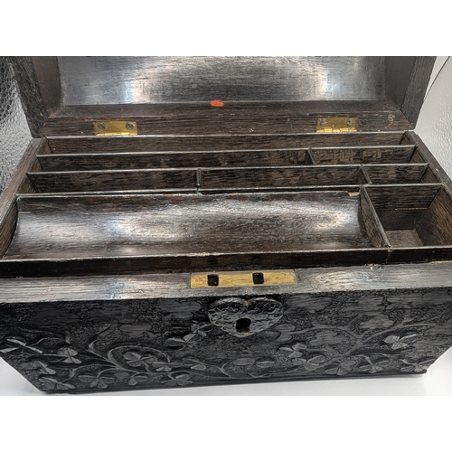 5 - 19th C. Irish bog oak dome topped writing box carved with Shamrocks and Harps. {14 cm H x 24 cm W x ... 