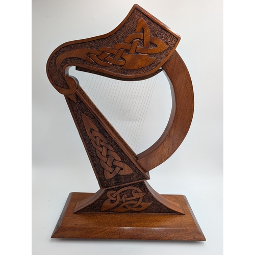55 - Mahogany Irish Prison Art model of Celtic Harp. {21 cm H x 38 cm W x 17 cm D}.