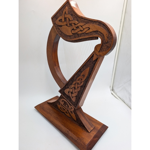 55 - Mahogany Irish Prison Art model of Celtic Harp. {21 cm H x 38 cm W x 17 cm D}.