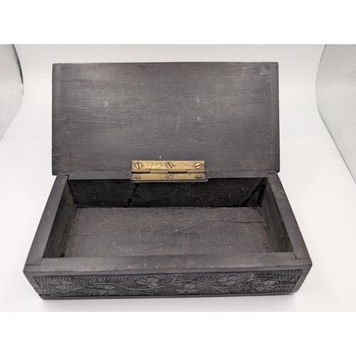 6 - 19th C. Irish bog oak box carved with Harps and Shamrocks. {4 cm H x 16 cm W x 8 cm D}.