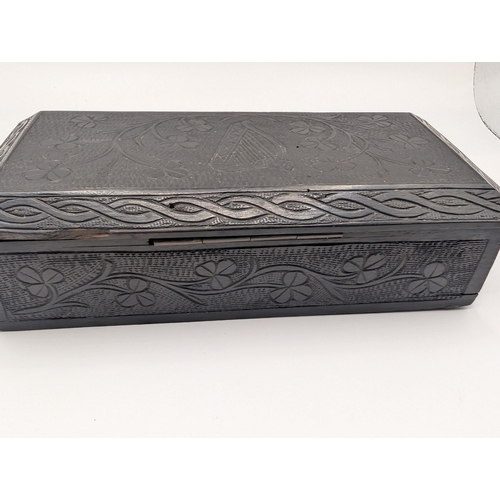 6 - 19th C. Irish bog oak box carved with Harps and Shamrocks. {4 cm H x 16 cm W x 8 cm D}.