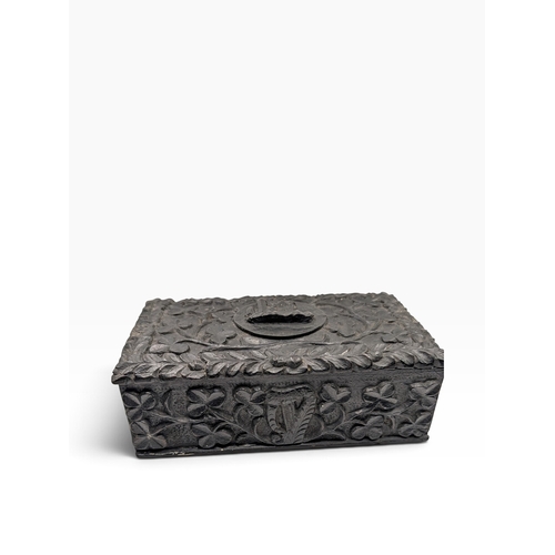 8 - 19th C. Irish bog oak box carved with Shamrocks and Harp. {7 cm H x 19 cm W x 4 cm D}.