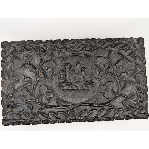 8 - 19th C. Irish bog oak box carved with Shamrocks and Harp. {7 cm H x 19 cm W x 4 cm D}.