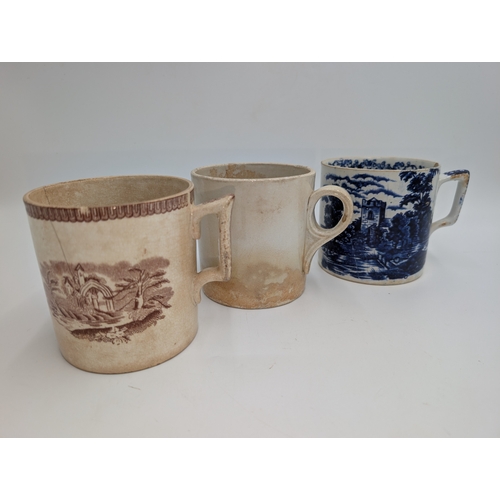 90 - Two 1st period Belleek mugs and a transferware mug. {10 cm H x 13 cm W x 10 cm D}.
