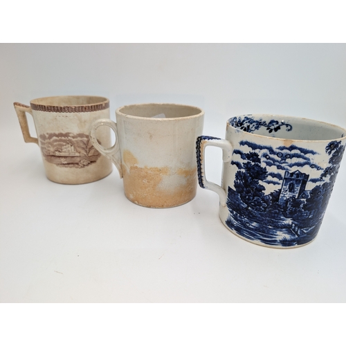 90 - Two 1st period Belleek mugs and a transferware mug. {10 cm H x 13 cm W x 10 cm D}.