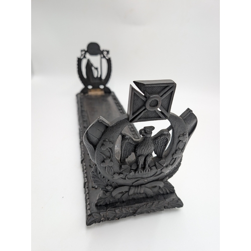 92 - 19th C. Irish carved bog oak book stand depicting Queen Maeve with a Harp and Eagle. {18 cm H x 49 c... 