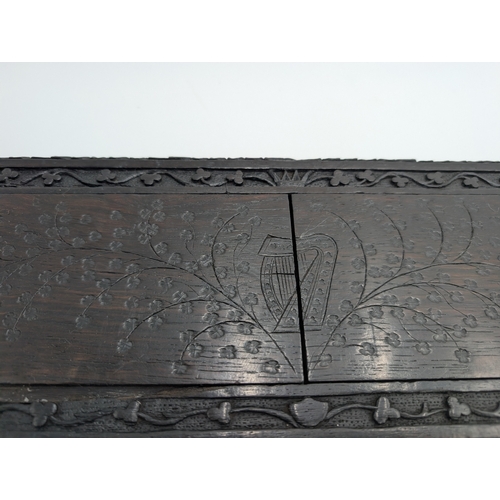 92 - 19th C. Irish carved bog oak book stand depicting Queen Maeve with a Harp and Eagle. {18 cm H x 49 c... 