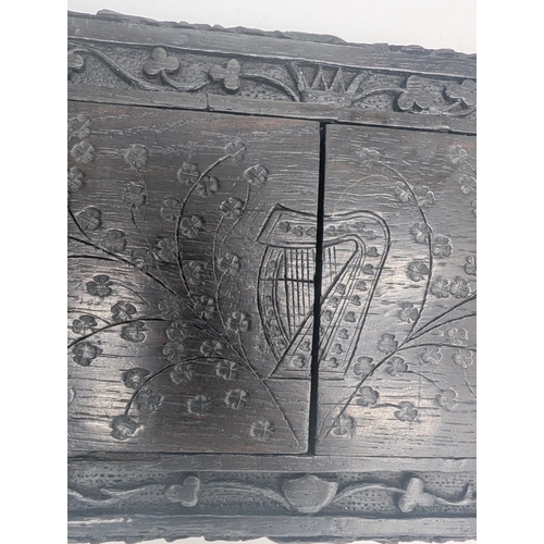 92 - 19th C. Irish carved bog oak book stand depicting Queen Maeve with a Harp and Eagle. {18 cm H x 49 c... 
