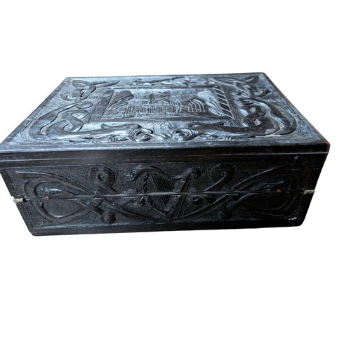 14 - 19th C. Irish bog oak box carved with Muckross Abbey and Celtic Cross. {13 cm H x 36 cm W x 25 cm D}... 