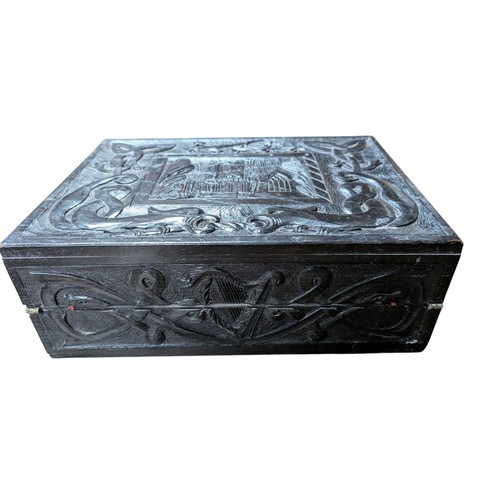 14 - 19th C. Irish bog oak box carved with Muckross Abbey and Celtic Cross. {13 cm H x 36 cm W x 25 cm D}... 
