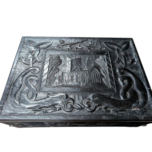 14 - 19th C. Irish bog oak box carved with Muckross Abbey and Celtic Cross. {13 cm H x 36 cm W x 25 cm D}... 
