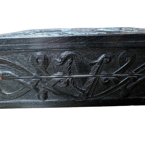 14 - 19th C. Irish bog oak box carved with Muckross Abbey and Celtic Cross. {13 cm H x 36 cm W x 25 cm D}... 