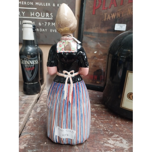 10 - Bols ceramic advertising figure in form of Bottle. {15 cm H x 10 cm W x 7 cm D}.