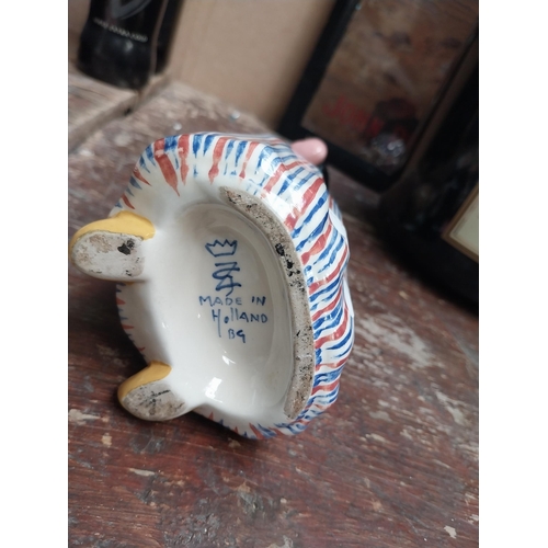 10 - Bols ceramic advertising figure in form of Bottle. {15 cm H x 10 cm W x 7 cm D}.