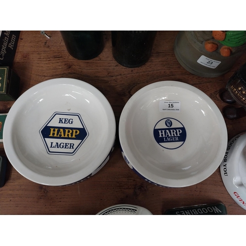 21 - Two Bristol Pottery Harp Lager ceramic ashtrays. {4 cm H x 15 cm Dia].