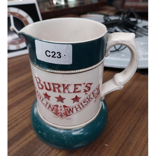 33 - Burke's Dublin Whiskey ceramic water advertising jug. {17 cm H x 15 cm W x 12 cm D}.