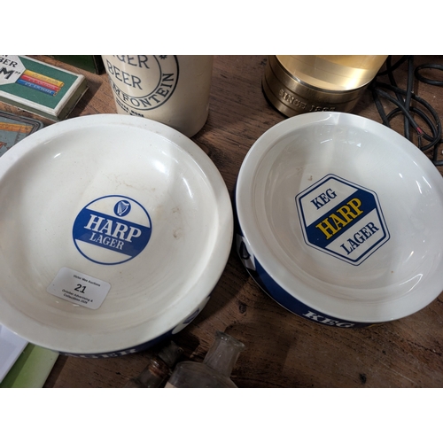 21 - Two Bristol Pottery Harp Lager ceramic ashtrays. {4 cm H x 15 cm Dia].