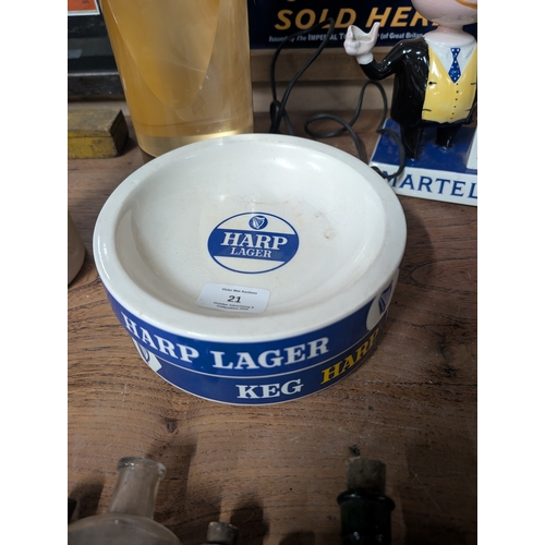 21 - Two Bristol Pottery Harp Lager ceramic ashtrays. {4 cm H x 15 cm Dia].