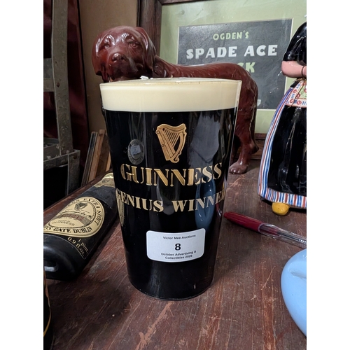 8 - Guinness plastic model of pint glass {14 cm H x 8 cm Dia.}  and Guinness bottle. {18 cm H x 5 cm W}.