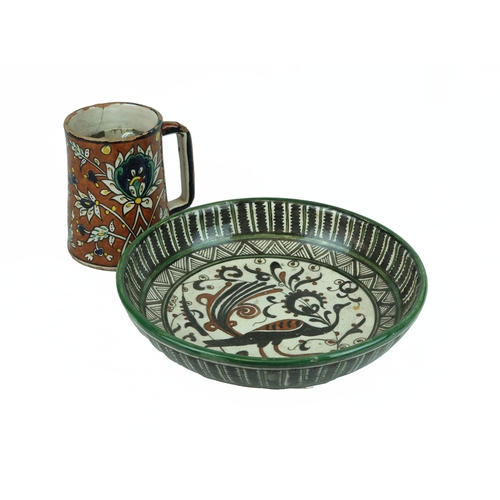 33 - A Polychrome-Painted Armenian Earthenware Pottery Dish and Mug, Jerusalem, circa 1948-1967. 

Of rou... 