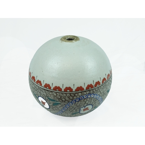 34 - A Kutahya Ornamental Pottery Ball, Ottoman Turkey, 20th Century. 

Of bulbous form decorated with sc... 