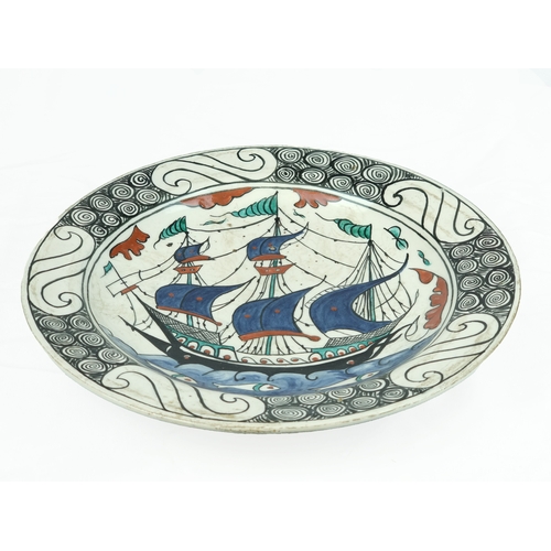 36 - An Iznik style Pottery ‘Ship Dish’, Cantagalli , Italy early 20th Century.
Of shallow rounded form w... 