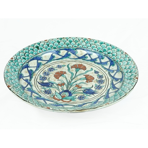 37 - An Iznik style  Pottery Dish, Cantagalli, Italy,early 20th Century.
Of shallow rounded form with eve... 