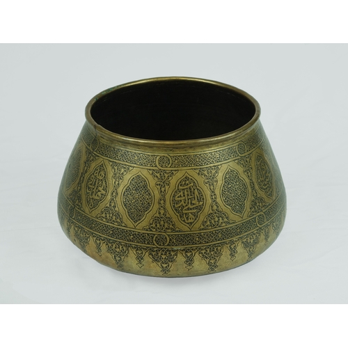 42 - Mamluk Style Engraved Brass Bowl, 19th Century .

Of rounded form with sides tapering to rounded rim... 