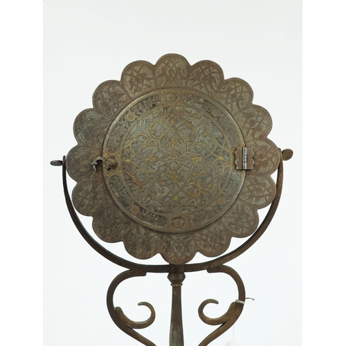 45 - A Fine Qajar Gold-Damascened Pierced Steel Mirror, Iran, 19th Century.

Of circular shape with palme... 