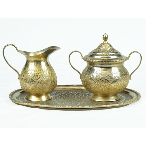 46 - A Gold-Gilded Metal Set, Late 19th Century, Ottoman Turkey.

A set of gold gilded metal milk jug and... 