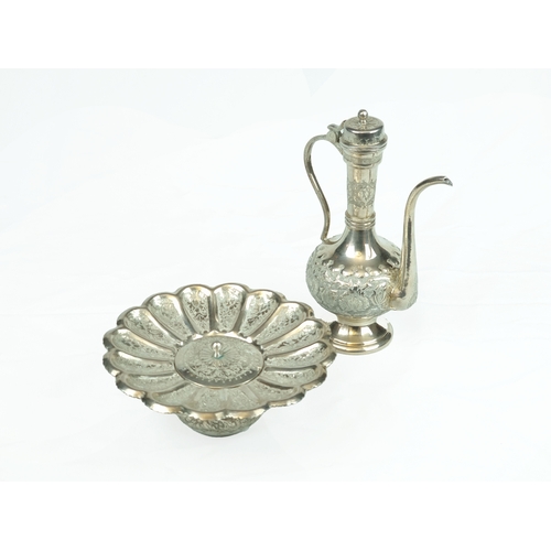 47 - A Silver Plated Tiny Ewer and Basin, India, 20th Century .

Of typical form, pear shaped ewer body w... 